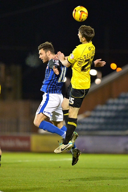 Scott Hogan and Shane Cansdell-Sherriff go up for a header