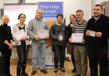 Takeaway owners learn about health improvement from Rochdale Borough Council's Ve Nutter (left) and Clare McNichol (third from right) during National Chip Week
