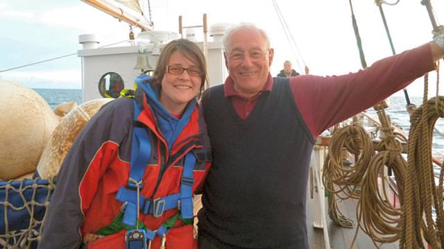 Andrew Evans enjoying life at sea with a crew member