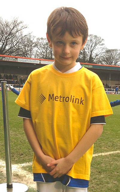 Seven-year-old Lewis Wright the Metrolink Mascot at Saturday’s FA Cup match against Sheffield Wednesday