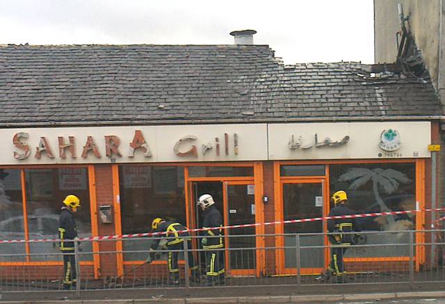 Fire crews damping down at the Sahara Grill