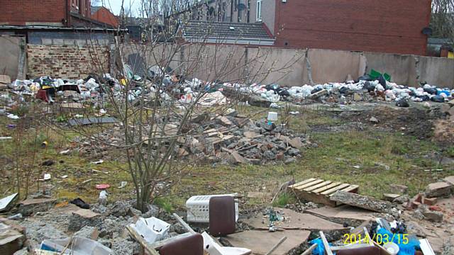 The open area between Vine Place, Ashfield Road and Milkstone Road filled with litter which the members of the group cleaned