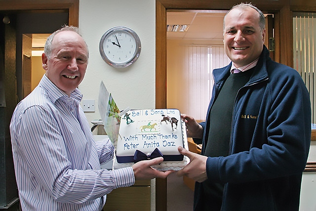 Steve Barton presents a cake from Peter Ross to Chris Bell