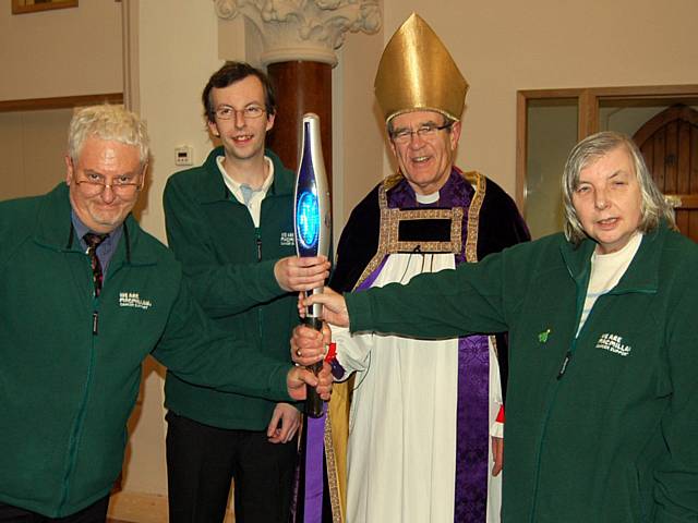 Jeffrey Hain and his son Christopher with    The Rt Revd Nigel McCulloch, retired Bishop of Manchester and Marion Hain