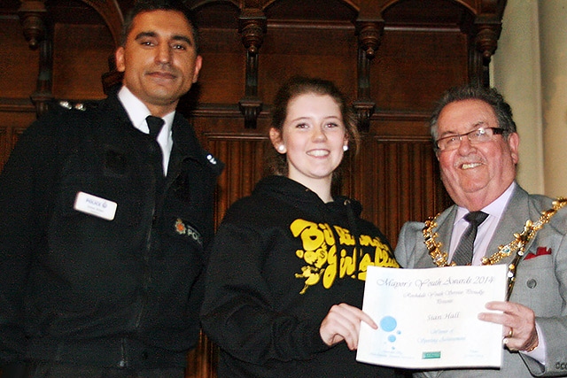 Sian Hall presented with the Individual Sporting Award by Mayor Peter Rush watched by Inspector Umer Khan