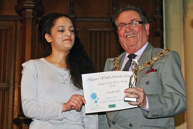 Zenab Ali presented with the Leader Volunteer award by Mayor Peter Rush