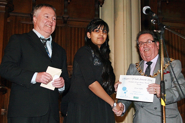 Kiran Iqbal presented with the Long Service Achievement award by Mayor Peter Rush watched by Senior Youth Officer Dave Baker