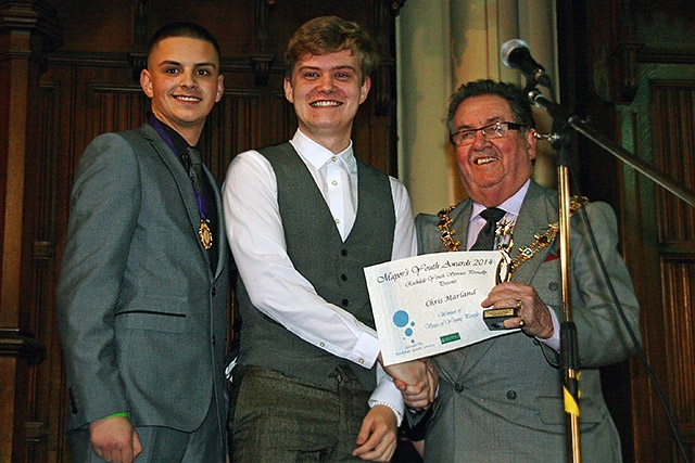 Chris Marland presented with the Voice for Young People Award by Mayor Peter Rush watched by Member of Youth Parliment Leon Hollinrake