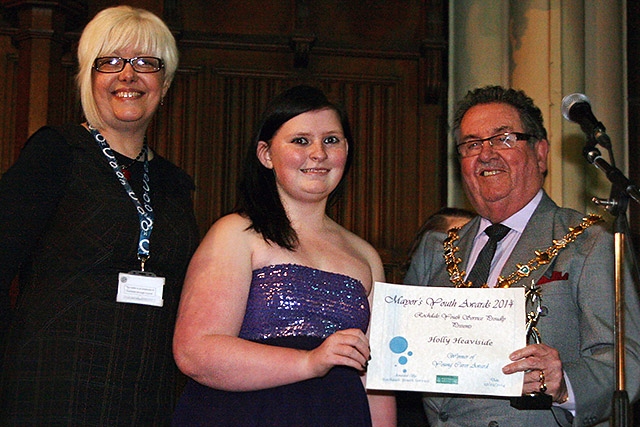 Holly Heaviside presented with the Young Carer Award by Mayor Peter Rush watched by Heather Mellalieu