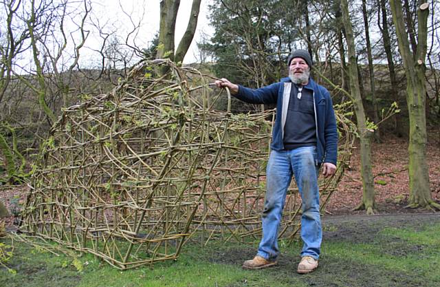 Ex-serviceman David Joddrell is creating the living sculpture of a First World War tank from willow on the main road at Healey Corner 