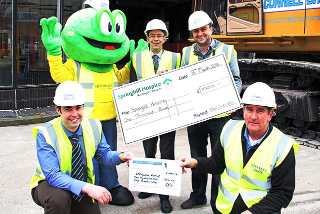 £1,000 cheque presentation - Springy the Hospice mascot, Councillor Colin Lambert, Danny Williams from Round Table and representatives from Connell Brothers