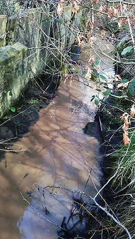 Water run off below Hurst Meadows containing sand