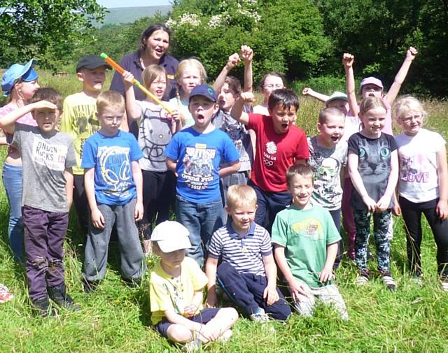 Judy Alderson, back, with Year 2 pupils at Holy Trinity School at a Forest School session