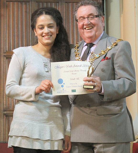 Zenab Ali receives her certificate from the Mayor, Councillor Peter Rush