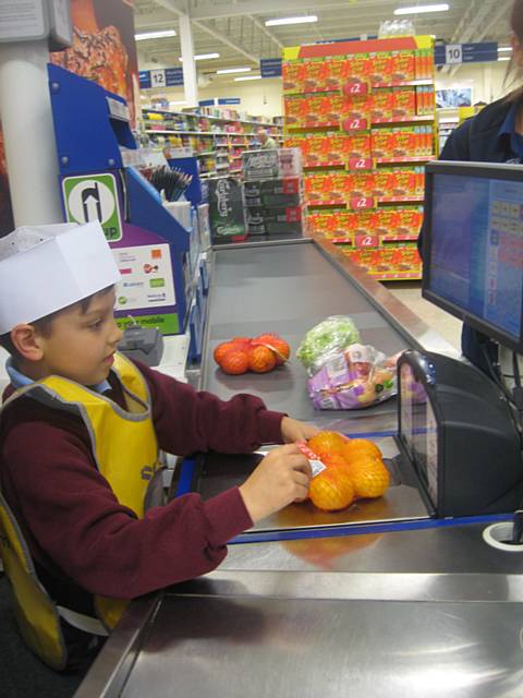 Oliver on the till