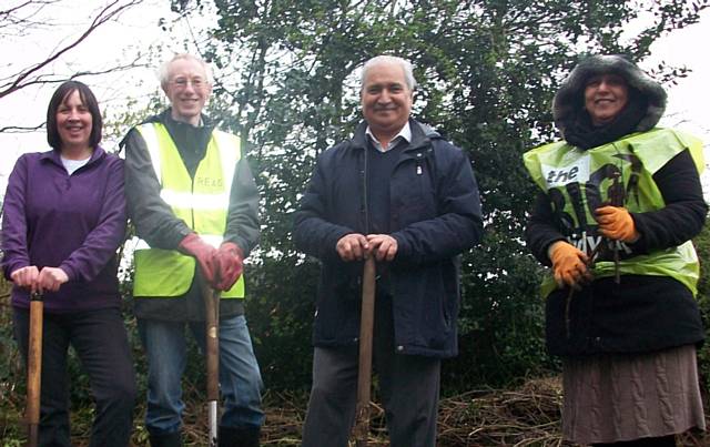 REAG spruced bushes and planted flowers in the car park of St John Church 