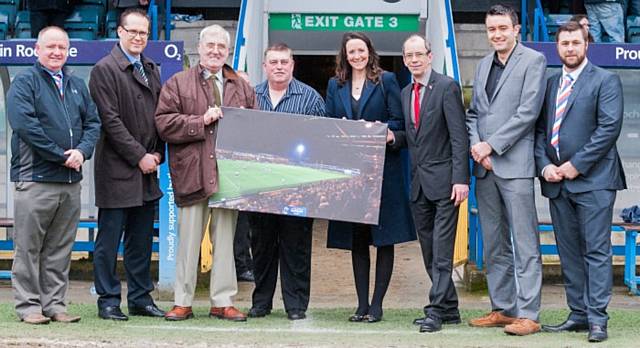 RLWC2013 General Manager Sally Bolton presents the Rochdale Consortia with a commemorative photo. (L to R) Mark Wynn, Chairman of Rochdale Hornets, John Dutton, Operations Manager at RLWC2013, Cllr Martin Burke, Chairman of the stadium company, Paul Swarbrick, Stadium Manager, Council Leader Colin Lambert, council Communications Manager Mark Roberts and Rochdale Hornets Chief Executive, Ryan Bradley.