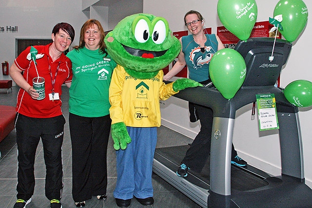 Springy The Hopsice Frog and Sarah Ford from Springhill Hopsice with staff from Link4Life at Rochdale Lesiure Centre