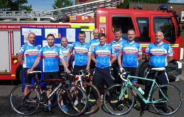 The team from the Greater Manchester Firefighters wearing cycling tops donated by Garmin Sharp