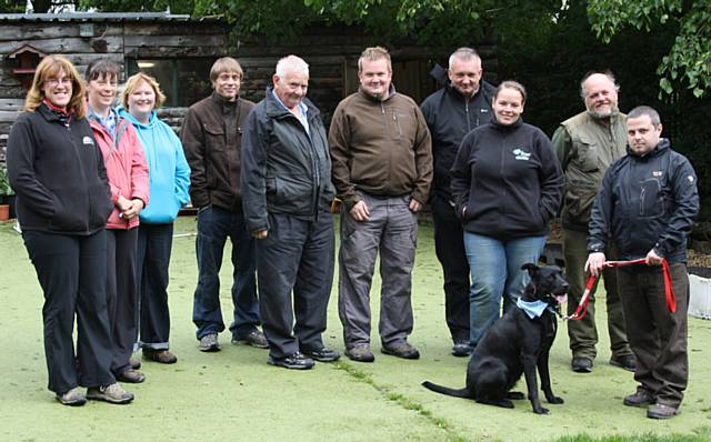 Handlers attending a training workshop with a reactive dog