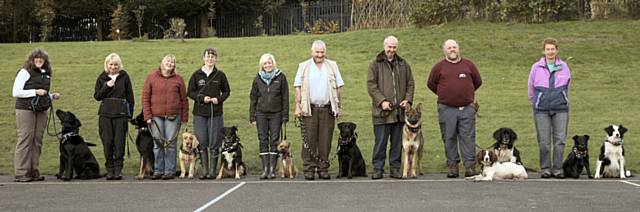 A proud moment for the Good Buddy handlers with their dogs