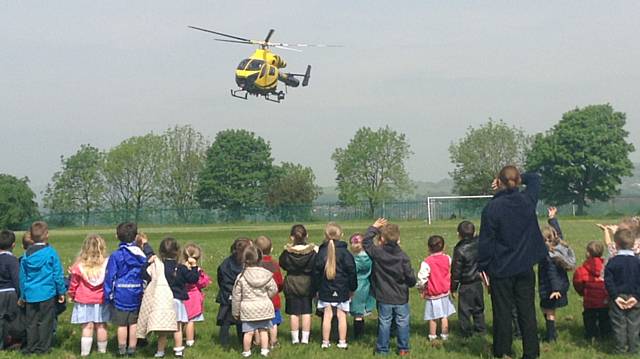 Our Lady and St Pauls Primary School, Darnhill, Nursery children welcome the Police Helicopter 