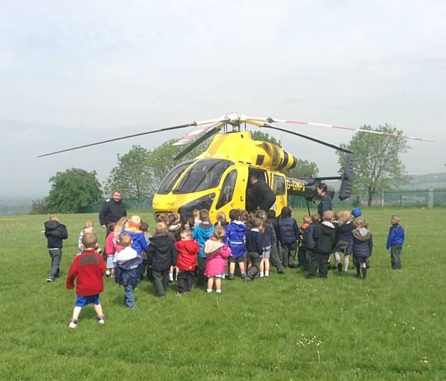 Our Lady and St Pauls Primary School, Darnhill, Nursery children welcome the Police Helicopter 