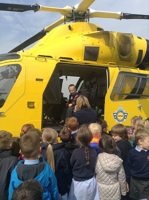 Our Lady and St Pauls Primary School, Darnhill, Nursery children welcome the Police Helicopter 