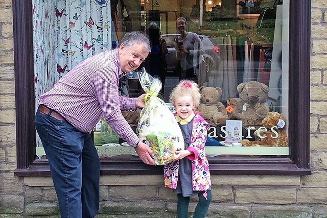 Scarlet Rigby receives her prize from Geoff Cowling