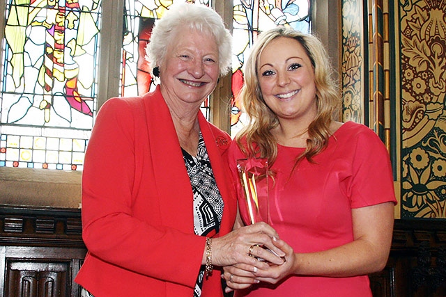 Katie Bowmer receiving her Junior Woman of Rochdale award from Dame Mary Peters