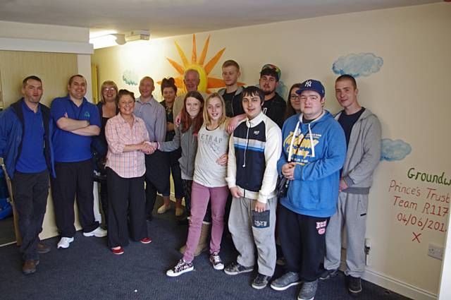 The young people who have been working on the Gateway Easy Does It community project, painting rooms, corridors and adding brightly coloured murals to interior walls