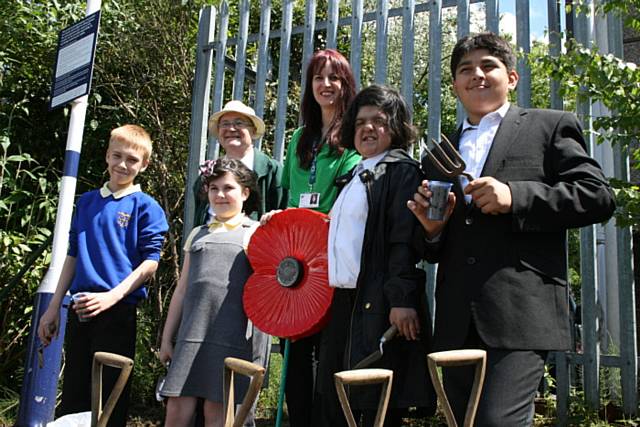 Acting Council Chief Executive Linda Fisher and Councillor Billy Sheerin are joined by pupils from St Edwards and Matthew Moss Schools