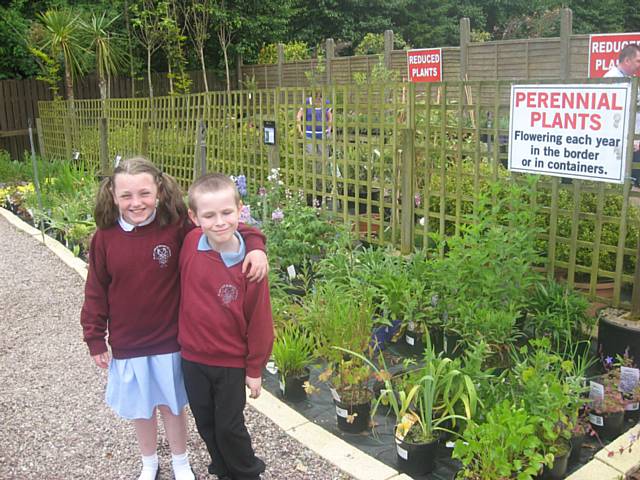 Louise and Payton picking perennial plants