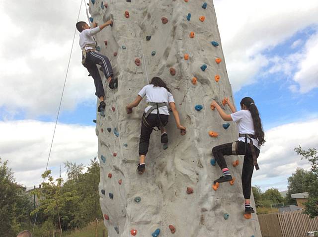 Key Stage 2 enjoying climbing and abseiling workshop