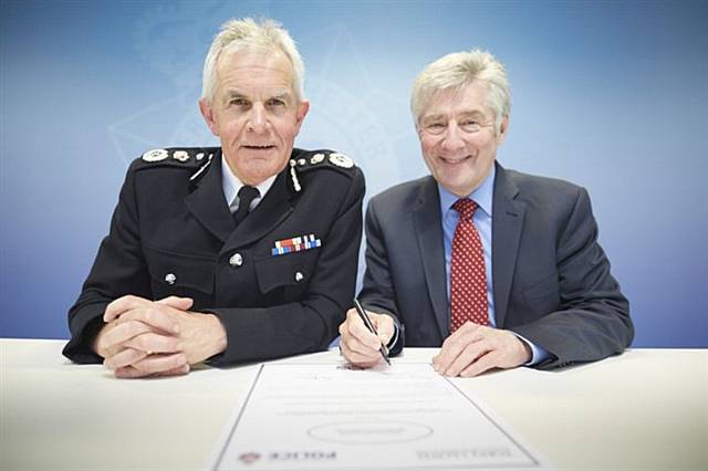 Chief Constable Sir Peter Fahy and Greater Manchester’s Police and Crime Commissioner Tony Lloyd signing the Greater Manchester Armed Forces Covenant
