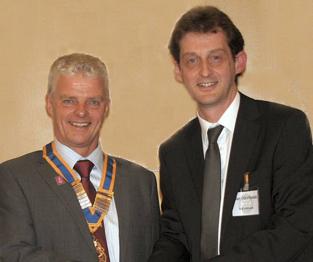 Bob Chadwick, Rochdale Rotary Club’s 88th President, receiving the Rotary Badge of Office from Immediate Past President Neil Helliwell