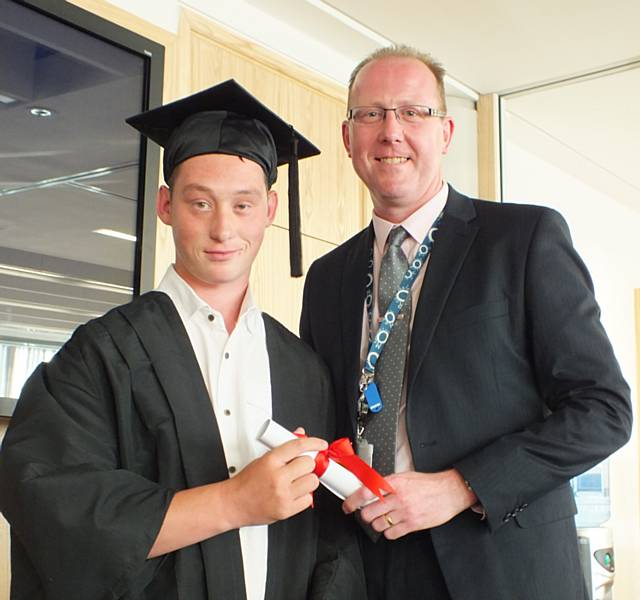 Mark Widdup, Rochdale Council Director of Economy and Environment presenting the  
Internship Graduation certificates