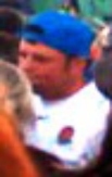 Witness picture eight: White male, white England rugby top, blue baseball cap worn backwards. 
