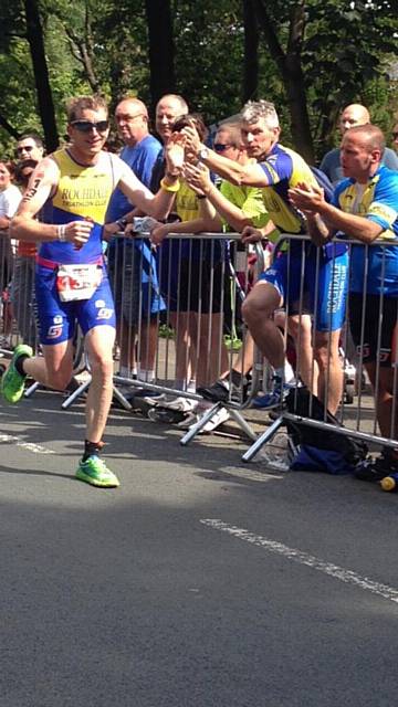 Chris Green takes the applause and encouragement of other club members on the marathon
