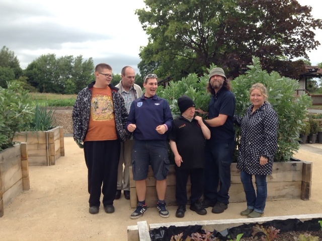 Springhill Hospice gardener Nick with garden helpers from Pure Innovations