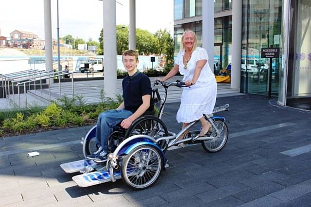 Visitor Matt Hadfield and the Mayoress Beverley Place have a go at the accessible bikes