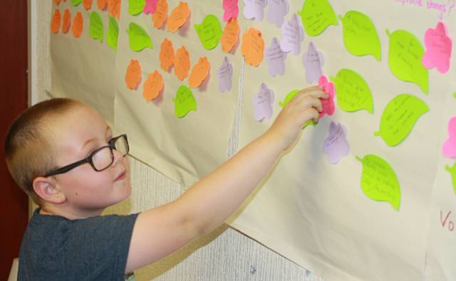 Luke Thetford updating the group’s wall charts 