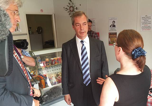 Nigel Farage and John Bickley talking to Janet Wyatt in Heywood