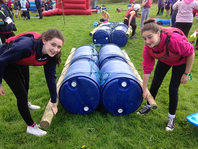 Jeska Kelly and Cleo Newbury of 101st Rochdale Guides taking part in raft building at Wellies & Wristbands Festival