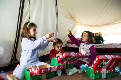 Christmas shoeboxes bring smiles to youngsters in a refugee camp last year