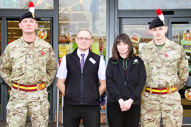 Jim Kenworthy, Damiam Hay store team manager, staff member Angie Coop and Cpl Sam Wilde