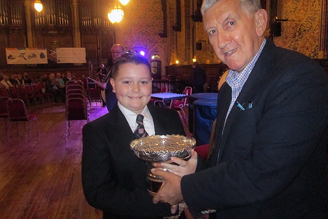 Rochdale Festival of Brass<br /> NWABBA President Malcolm Brownbill presenting the second place trophy to Pemberton (Old) Wigan DW Band