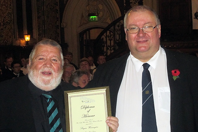 Rochdale Festival of Brass<br /> Local bandsman Bryan Warrington (left) receiving the NWABBA long service award from NWABBA Chairman Richard Milton