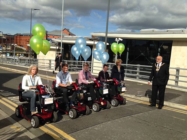 Mayor Surinder Biant starts the Shopmobility scooter race with Jonathan Hindle, Luke Settle, Adam Clegg, Christine Buckley