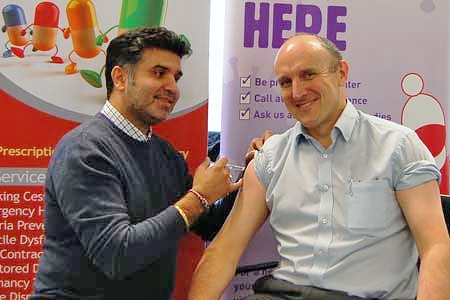 Dr Chris Duffy, Chairman of NHS Heywood, Middleton and Rochdale Clinical Commissioning Group, has his flu jab